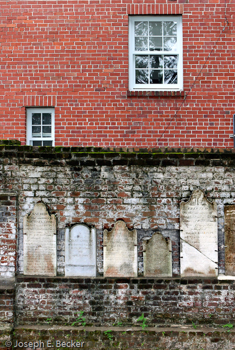 Although more than 10,000 people are buried at Colonial Park Cemetery in Savannah, Georgia, only about 600 headstones remain. Some misplaced headstones have been mounted on the brick side wall of the cemetery.